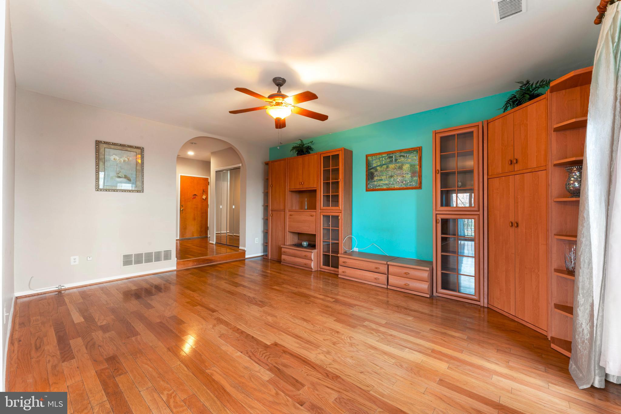 301 Byberry Road, Unit F1 Philadelphia, PA 19116 - Photo 8 of 30 wooden floor in an empty room with a window
