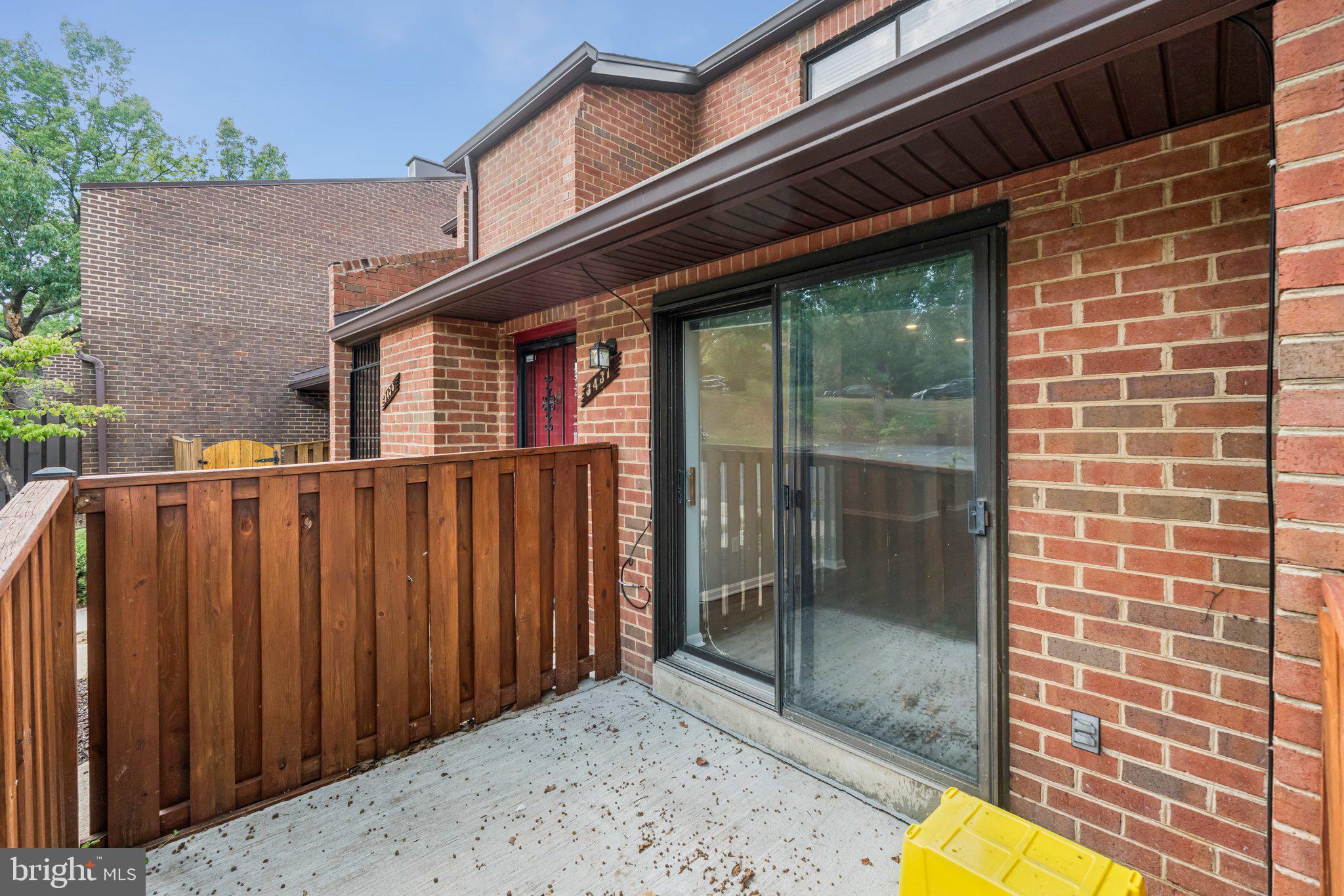 3437 Summit Court Northeast, Unit 3437 Washington, DC 20018 - Photo 23 of 26 a view of a brick house with a small backyard