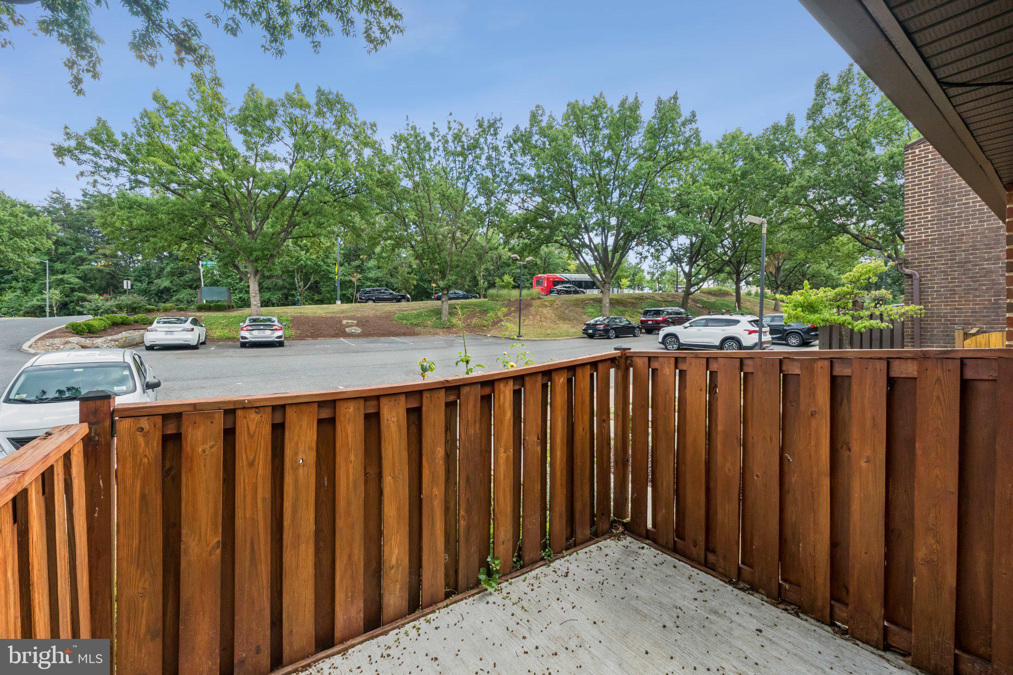3437 Summit Court Northeast, Unit 3437 Washington, DC 20018 - Photo 24 of 26 a view of wooden fence and trees in the background
