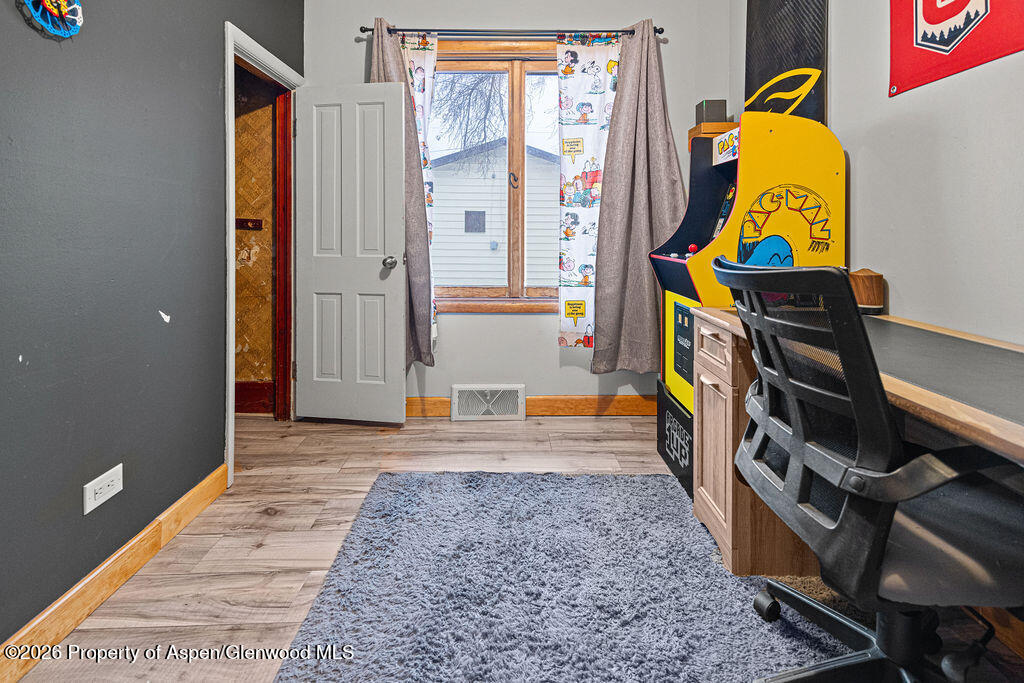 761 Rose Street Craig, CO 81625 - Photo 30 of 46 a view of an entryway with wooden floor