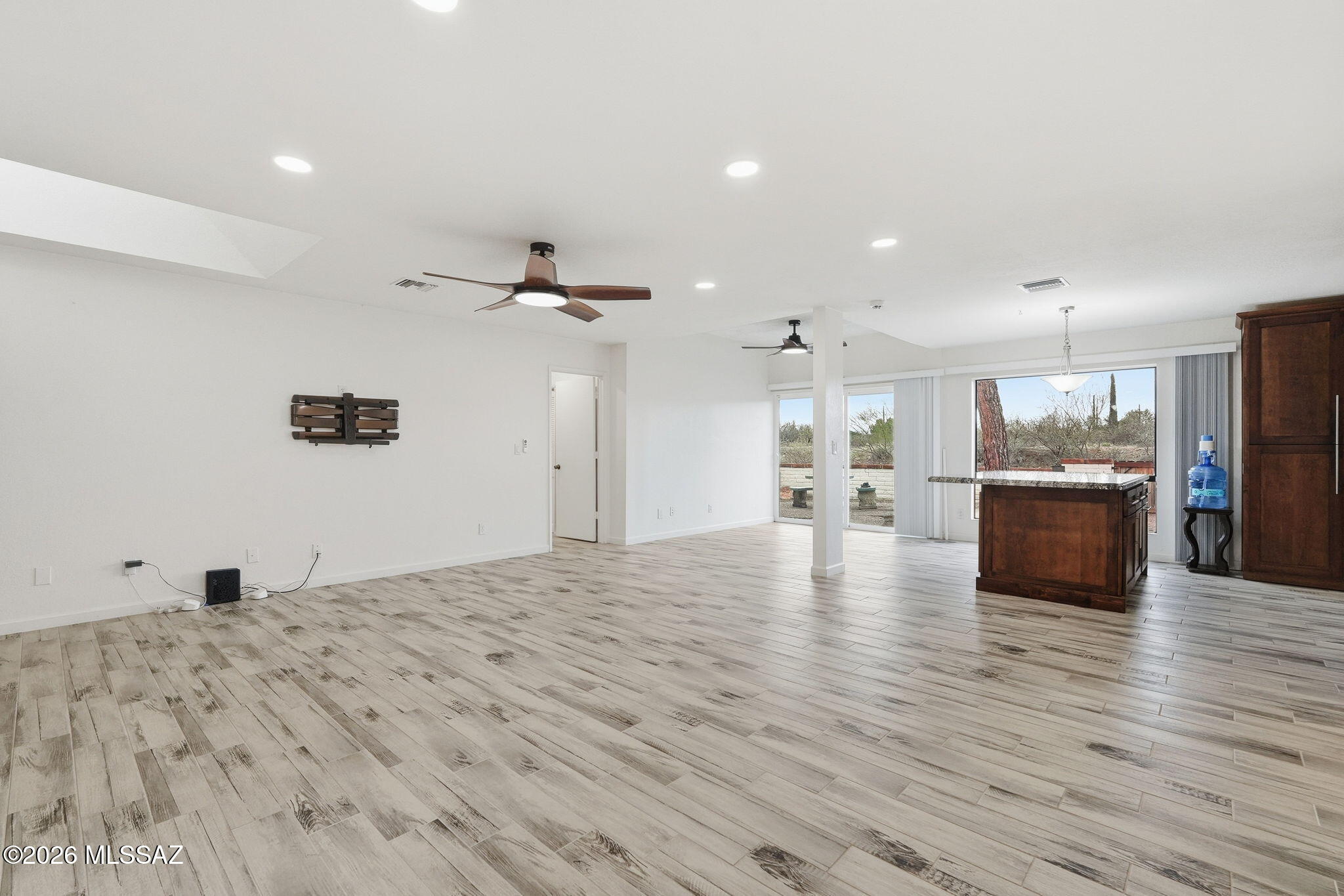 1183 Circulo Canario Rio Rico, AZ 85648 - Photo 3 of 31 a view of kitchen and kitchen with a wooden floor