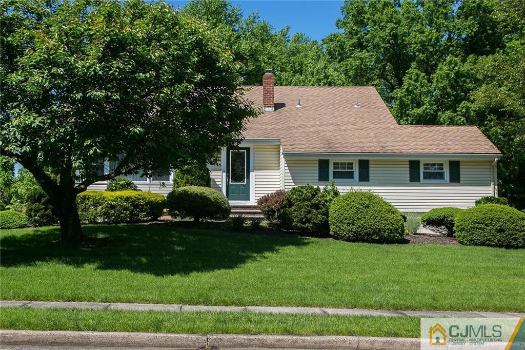28 Timber Road Edison, NJ 08820 - Photo 1 of 23 a front view of a house with a garden