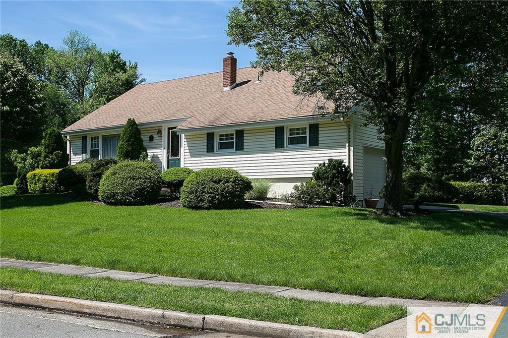 28 Timber Road Edison, NJ 08820 - Photo 2 of 23 a front view of a house with a yard