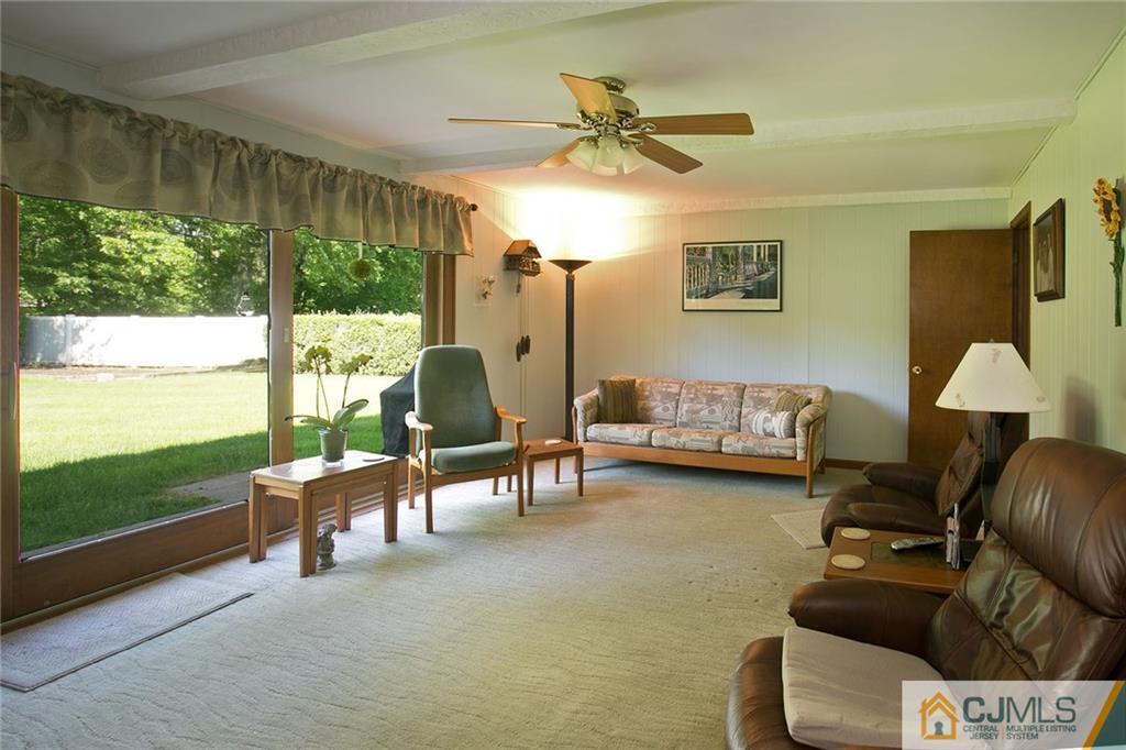 28 Timber Road Edison, NJ 08820 - Photo 12 of 23 a living room with furniture and a large window