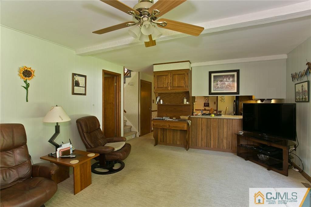 28 Timber Road Edison, NJ 08820 - Photo 13 of 23 a living room with furniture and a flat screen tv