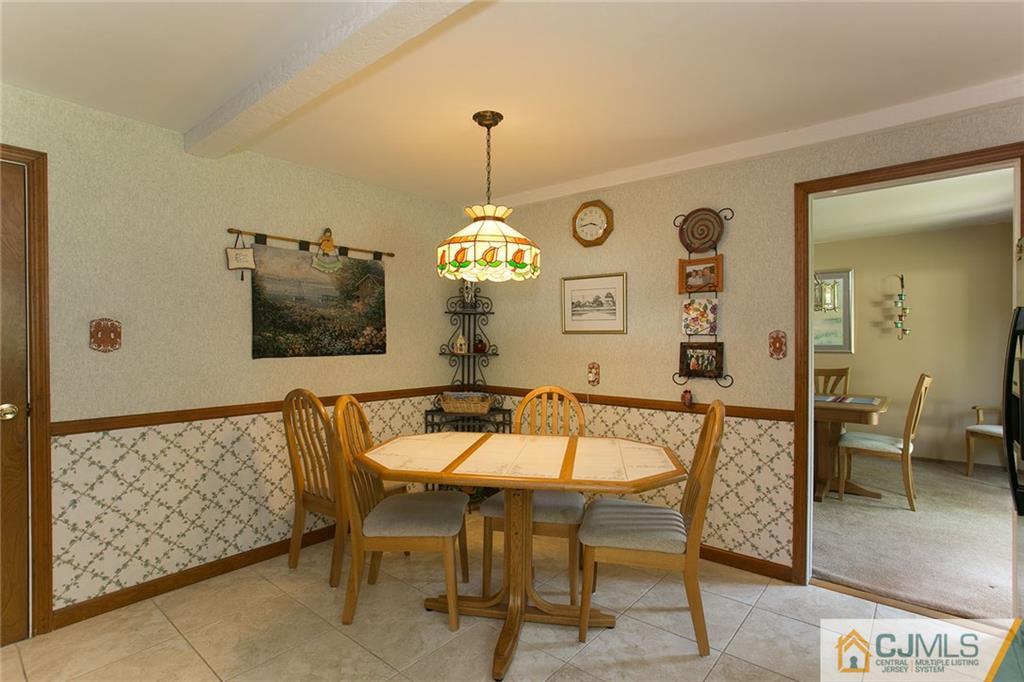 28 Timber Road Edison, NJ 08820 - Photo 15 of 23 a dining room with furniture and window
