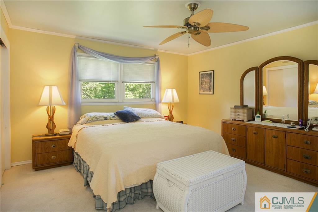 28 Timber Road Edison, NJ 08820 - Photo 18 of 23 a bedroom with a bed a dresser and a large window