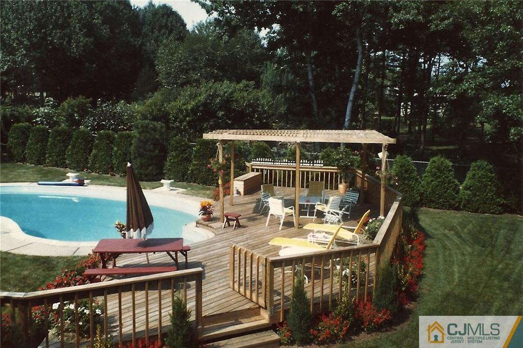 28 Timber Road Edison, NJ 08820 - Photo 5 of 23 a view of a swimming pool with a patio and backyard