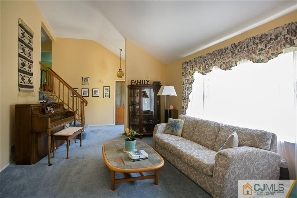 28 Timber Road Edison, NJ 08820 - Photo 8 of 23 a living room with furniture and a large window