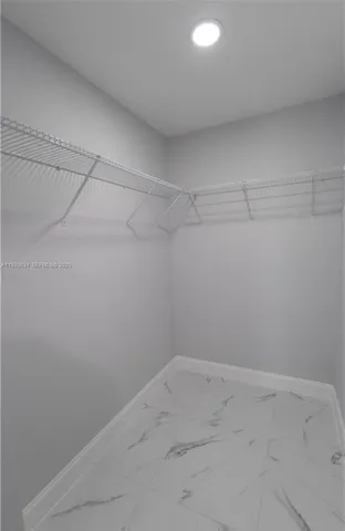 a view of a room with racks on the wall