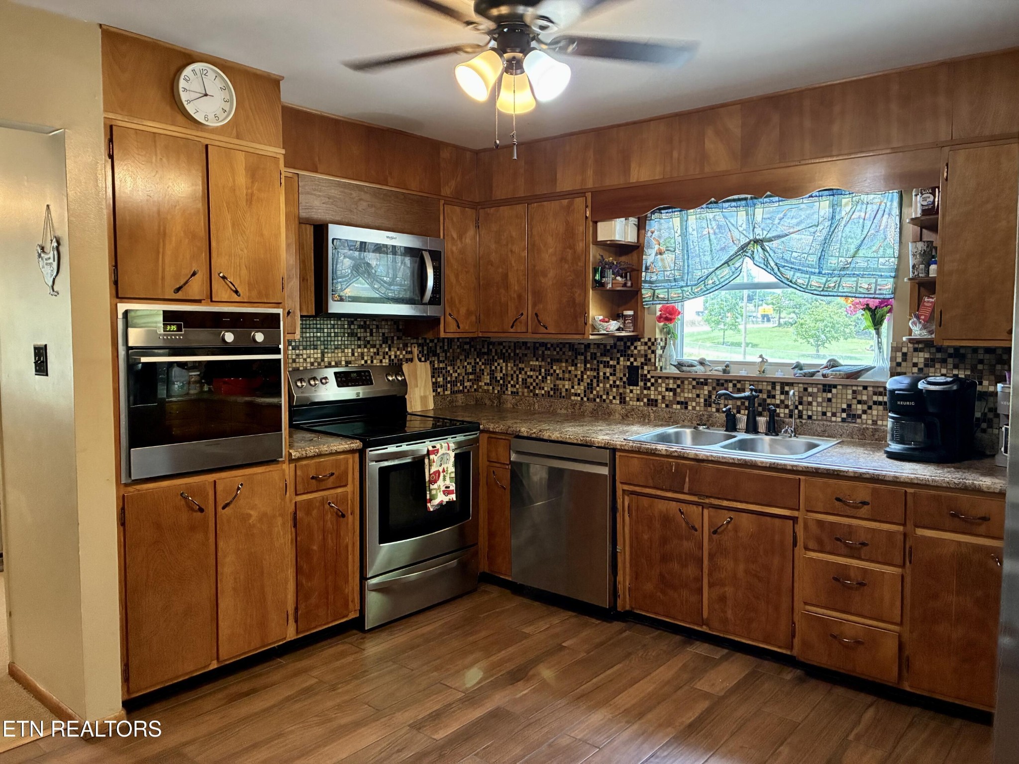 1907 Tazewell Pike Corryton, TN 37721 - Photo 16 of 42 a kitchen with stainless steel appliances granite countertop a stove and a sink