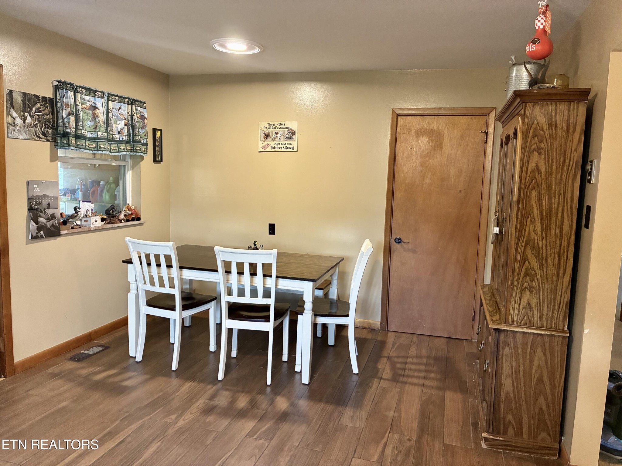 1907 Tazewell Pike Corryton, TN 37721 - Photo 18 of 42 a dining room with furniture and wooden floor