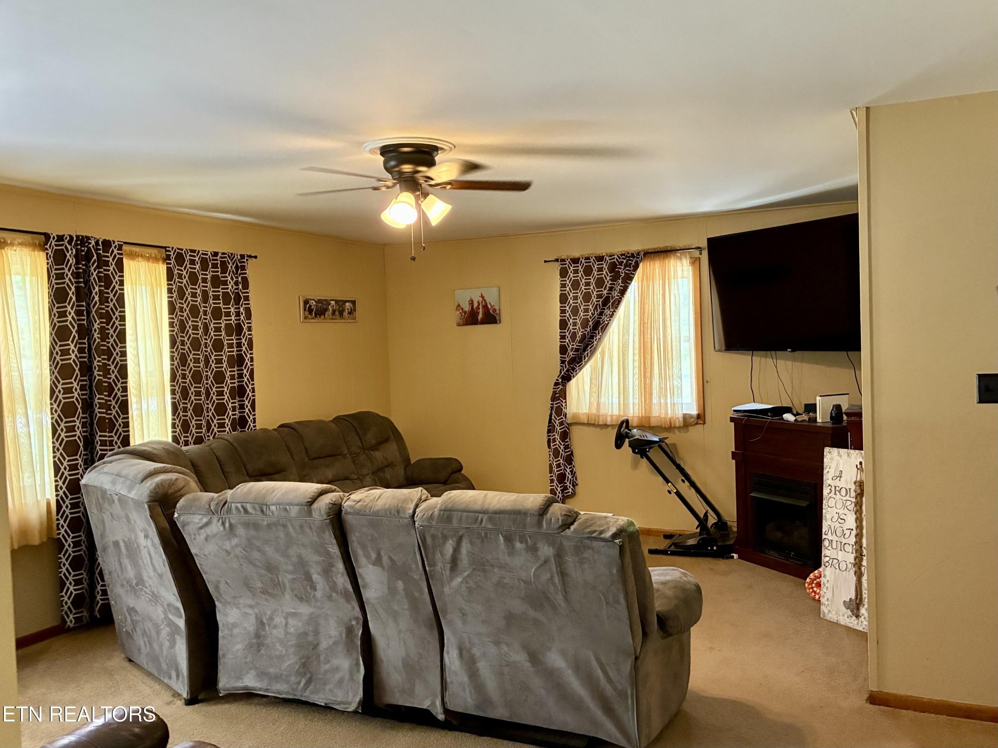 1907 Tazewell Pike Corryton, TN 37721 - Photo 19 of 42 a living room with furniture and a flat screen tv