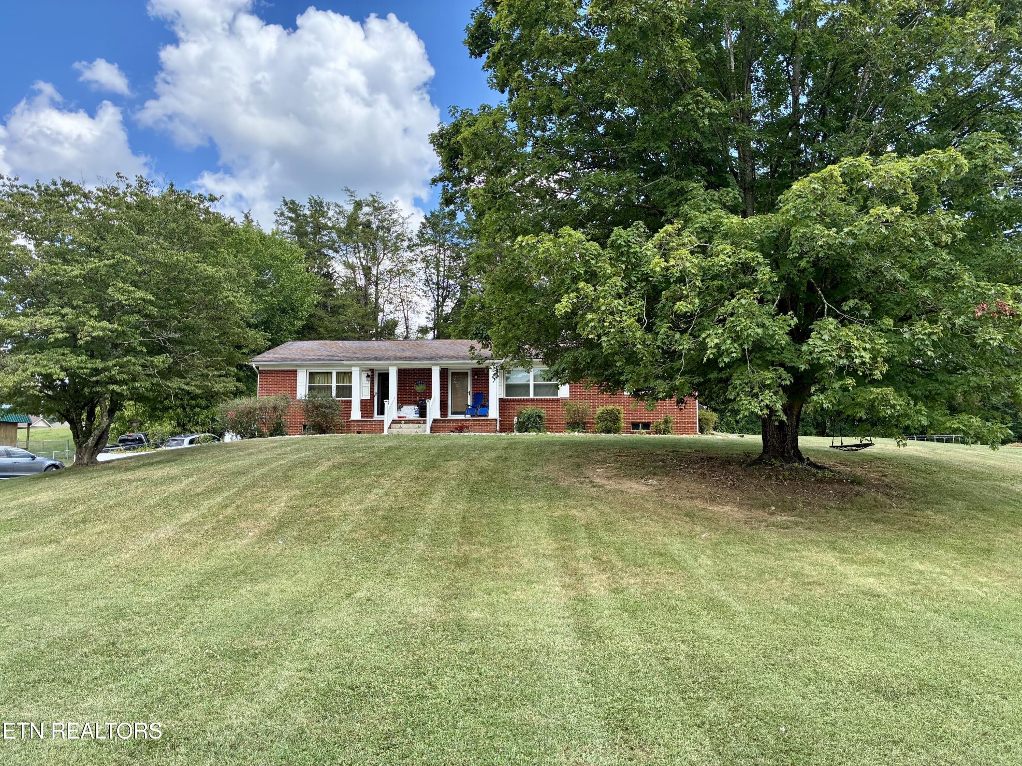 1907 Tazewell Pike Corryton, TN 37721 - Photo 2 of 42 a front view of a house with a yard