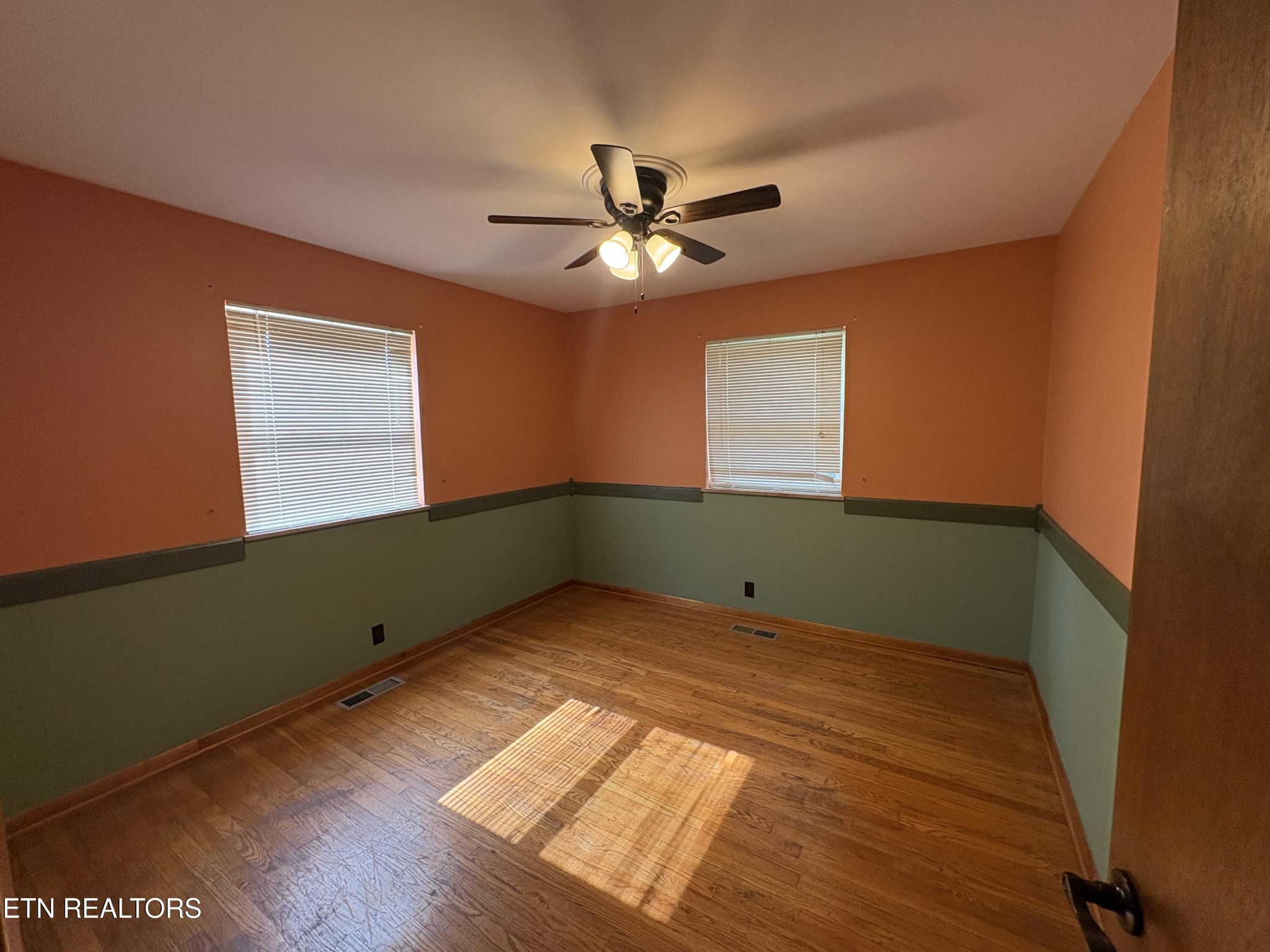 1907 Tazewell Pike Corryton, TN 37721 - Photo 31 of 42 a view of an empty room with a window and wooden floor