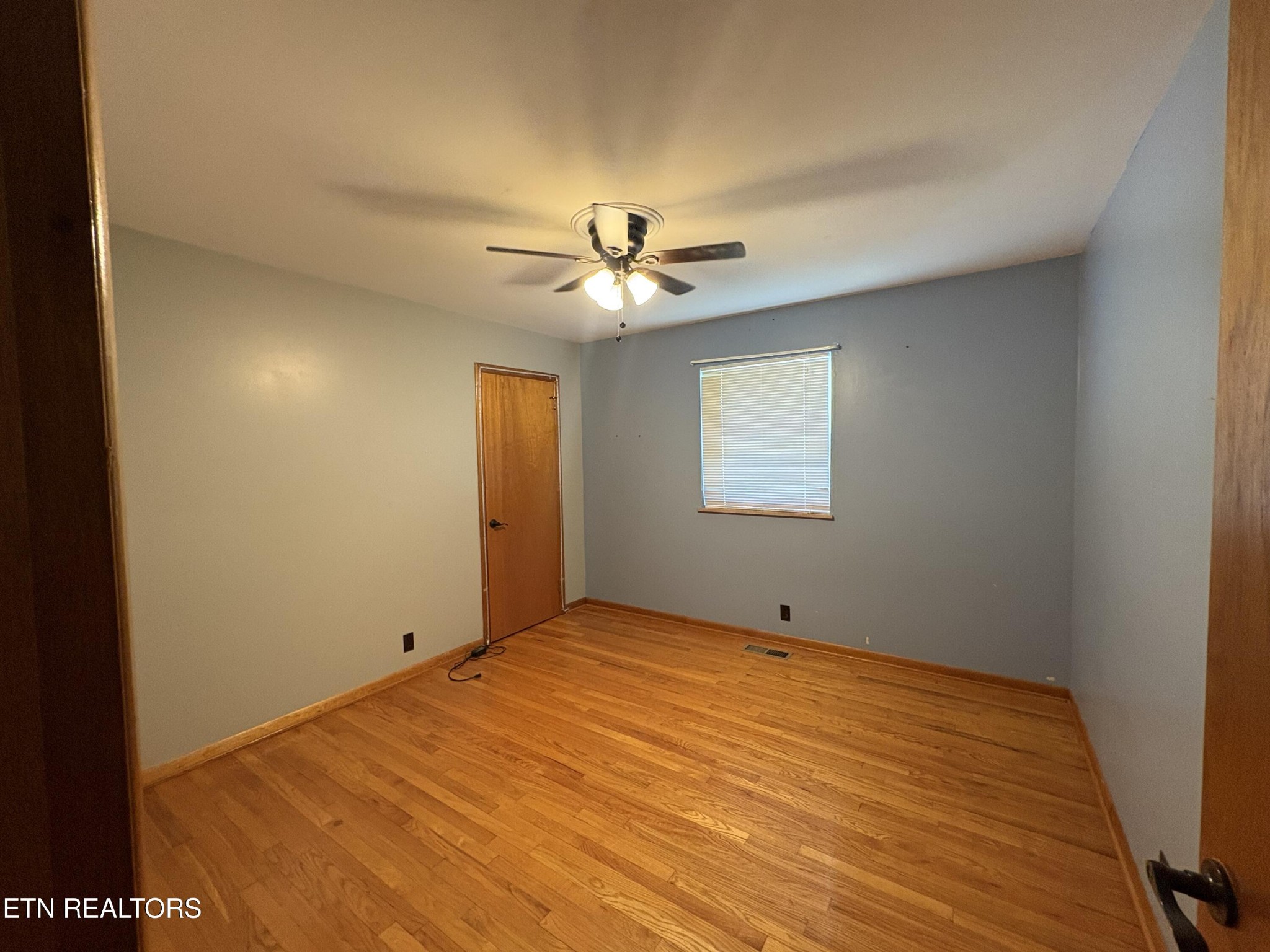 1907 Tazewell Pike Corryton, TN 37721 - Photo 33 of 42 a view of a room with a ceiling fan and a window