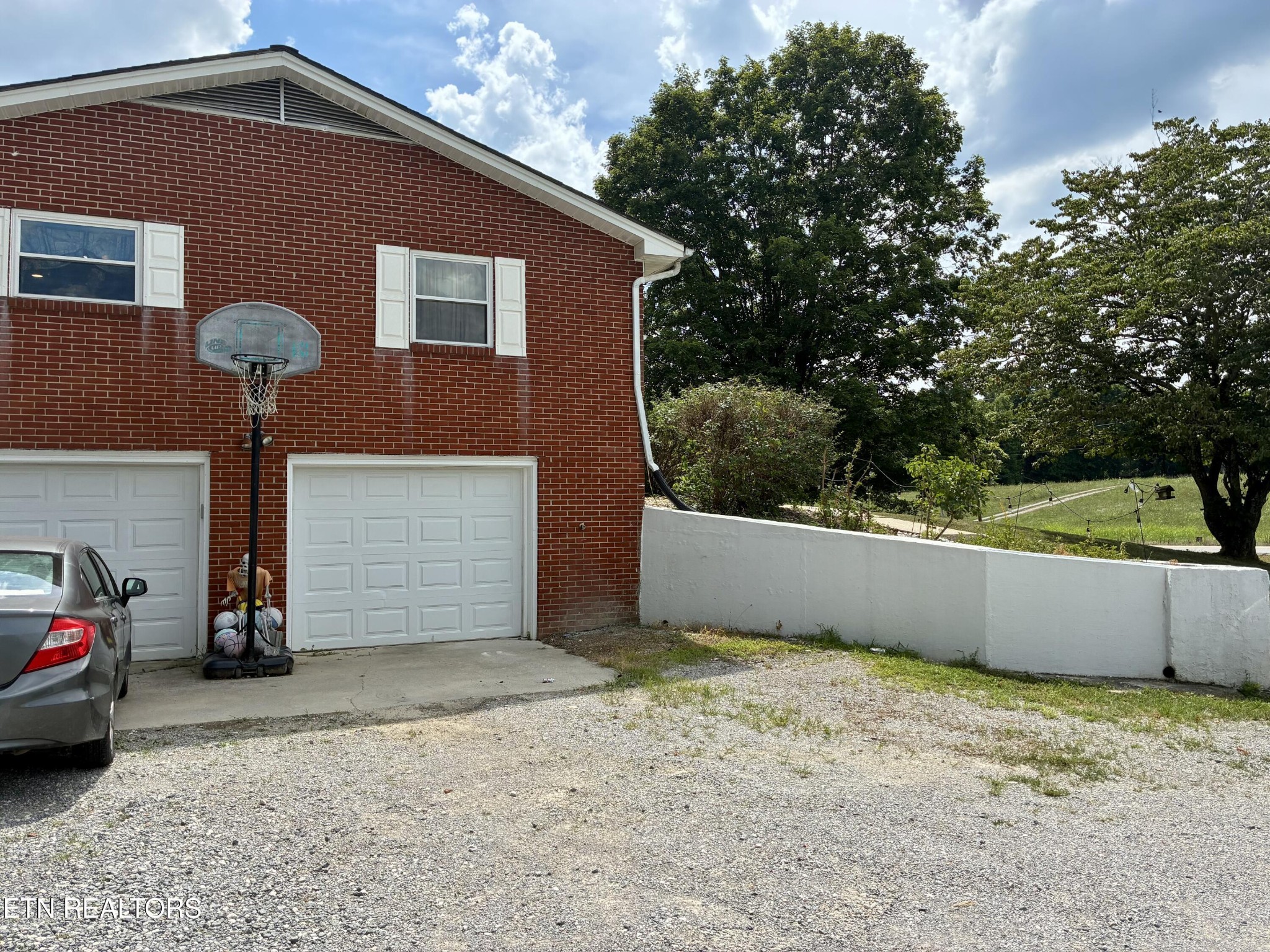 1907 Tazewell Pike Corryton, TN 37721 - Photo 5 of 42 a front view of a house with a yard