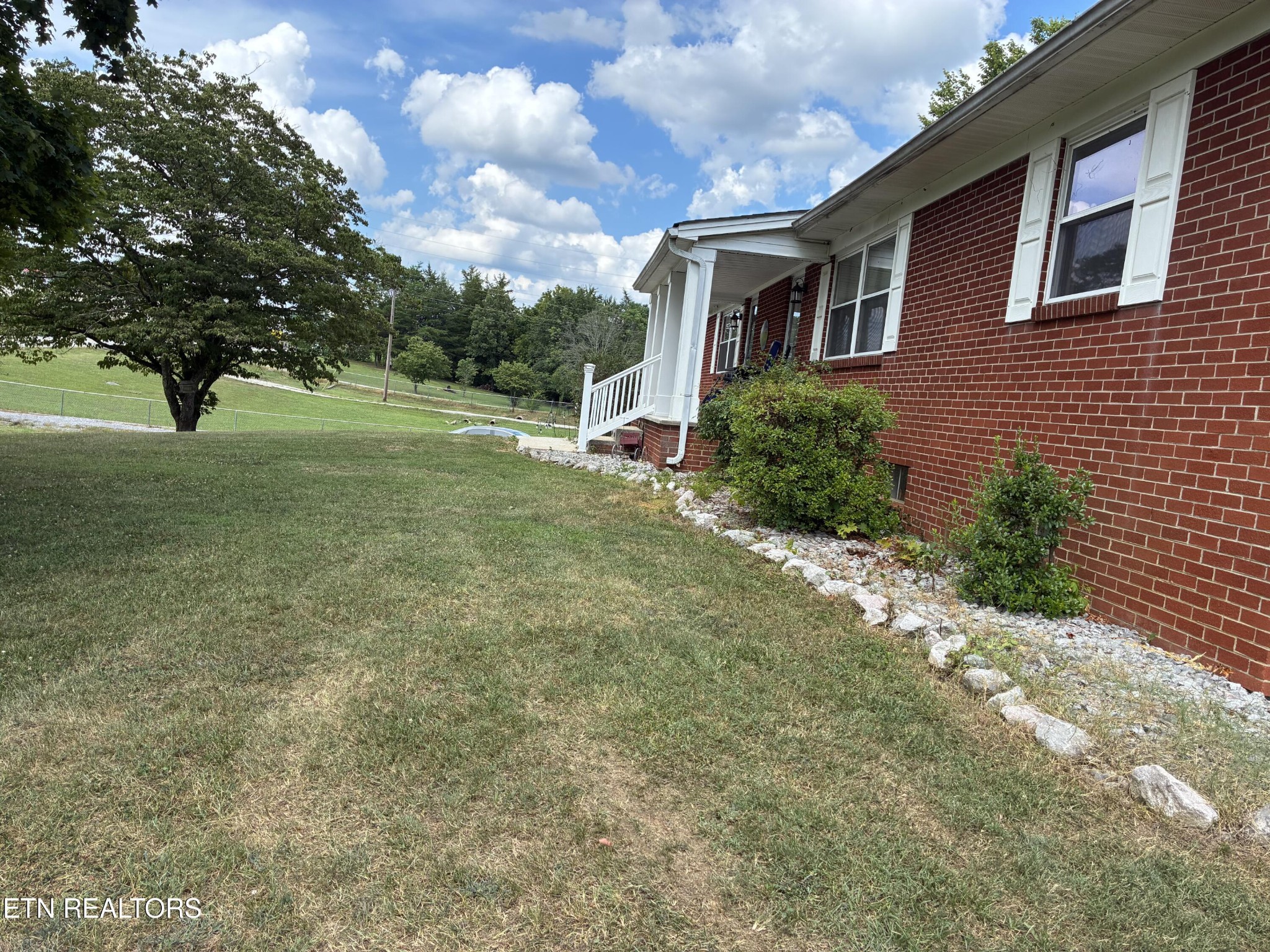1907 Tazewell Pike Corryton, TN 37721 - Photo 9 of 42 a view of a house with a backyard