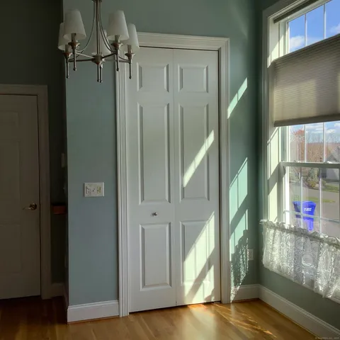 an entryway with wooden floor