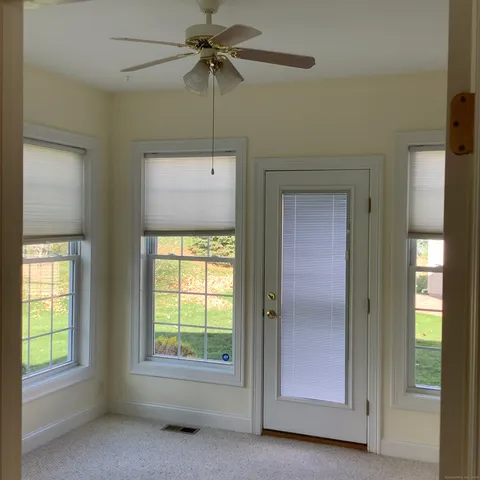 a view of a bathroom with a glass door