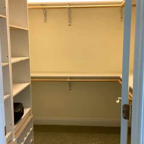 a white toilet sitting next to a shower curtain
