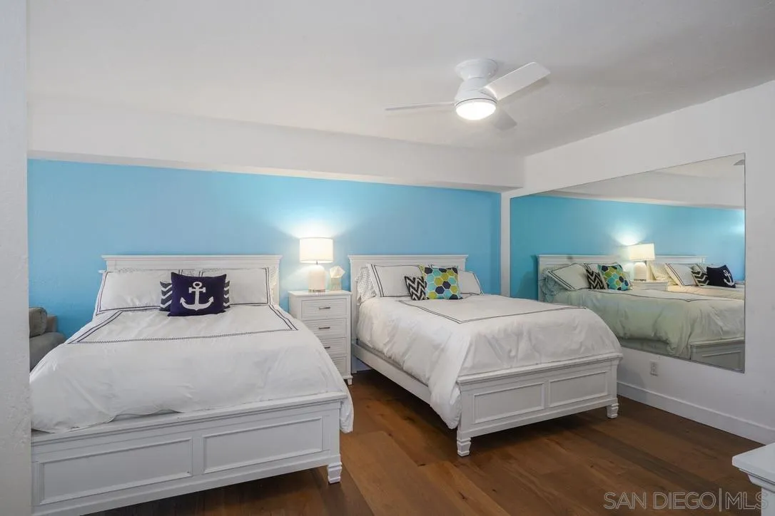 13053 Caminito Del Rocio Del Mar, CA 92014 - Photo 20 of 49 a bedroom with double bed and a large mirror