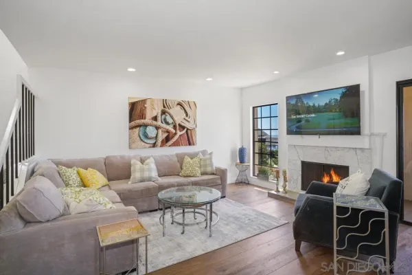 a living room with furniture and a fireplace