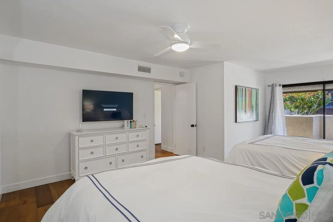 13053 Caminito Del Rocio Del Mar, CA 92014 - Photo 22 of 49 a bedroom with a bed and a television
