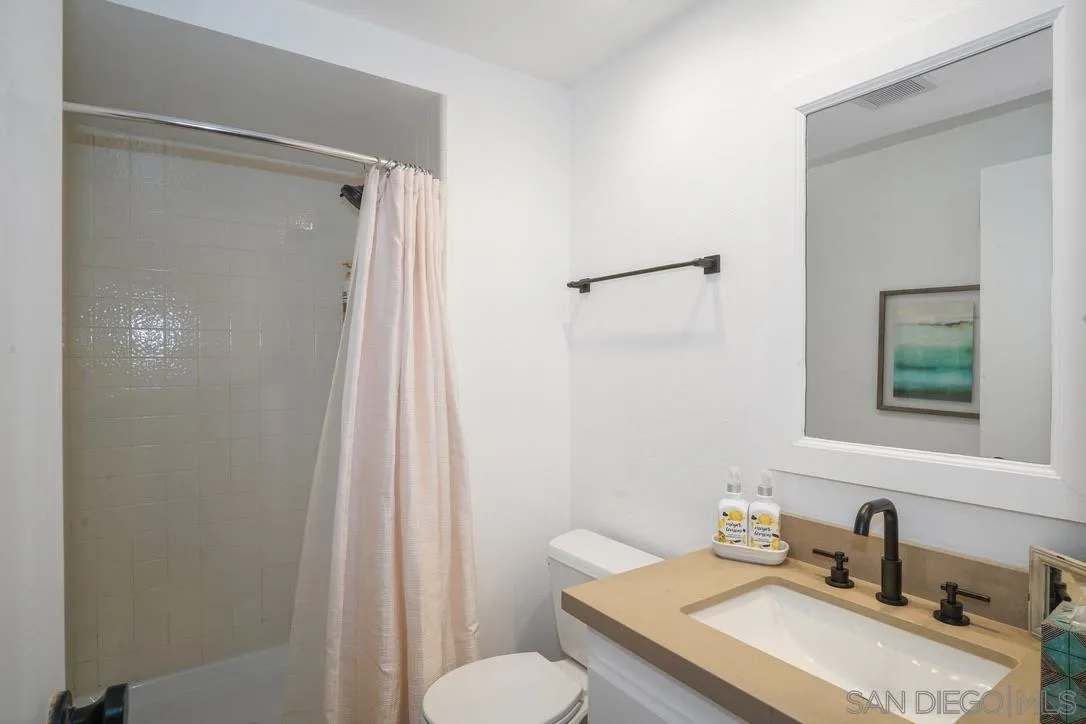 13053 Caminito Del Rocio Del Mar, CA 92014 - Photo 29 of 49 a bathroom with a sink toilet and shower