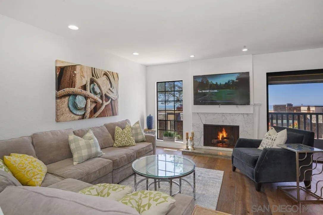 13053 Caminito Del Rocio Del Mar, CA 92014 - Photo 3 of 49 a living room with furniture and a fireplace