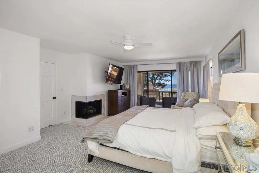 13053 Caminito Del Rocio Del Mar, CA 92014 - Photo 35 of 49 a bedroom with a bed and a television