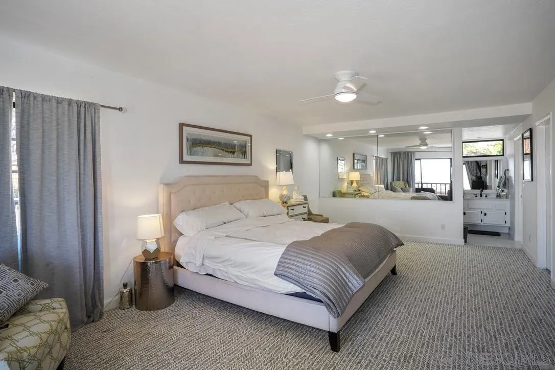 13053 Caminito Del Rocio Del Mar, CA 92014 - Photo 36 of 49 a spacious bedroom with a large bed and a view of bedroom