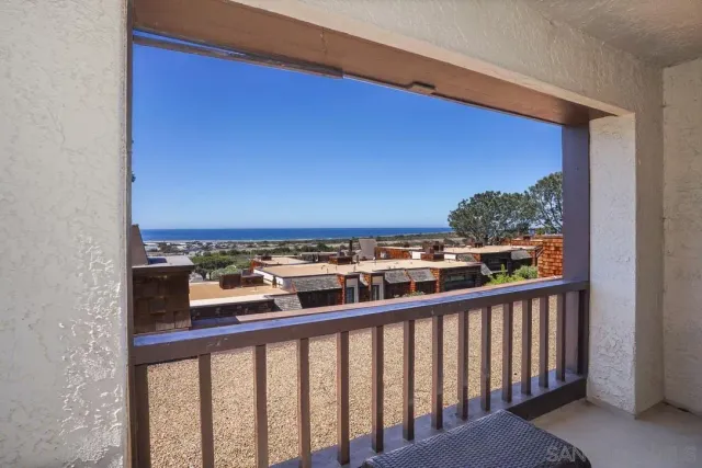 a view of a balcony with city view
