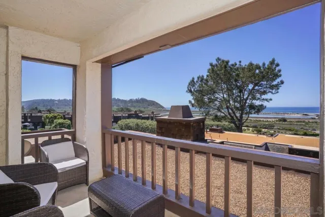 a view of a two chairs in the balcony