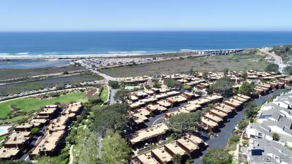 an aerial view of beach and ocean
