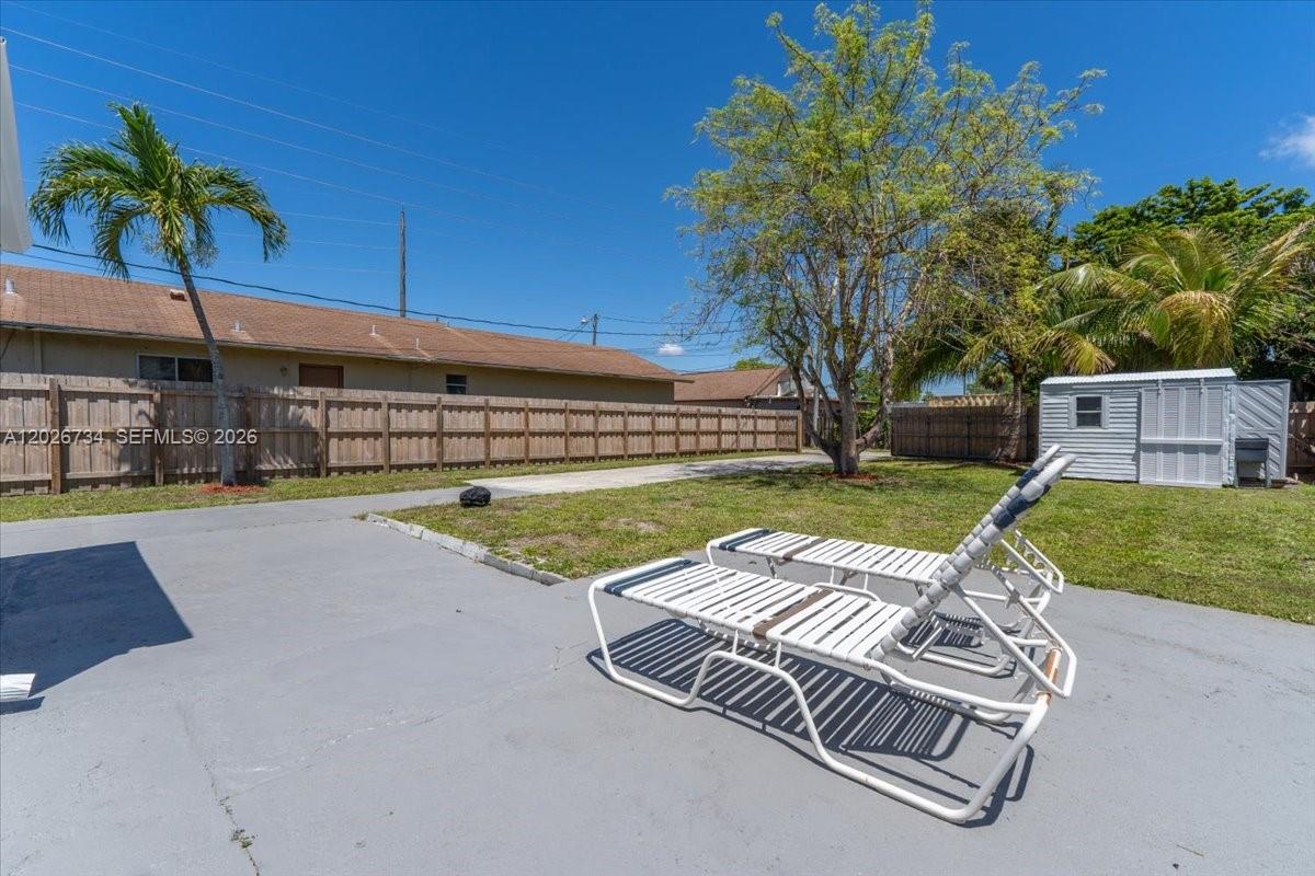 266 Southwest 6th Street Dania Beach, FL 33004 - Photo 28 of 37 a view of a backyard with a garden and plants
