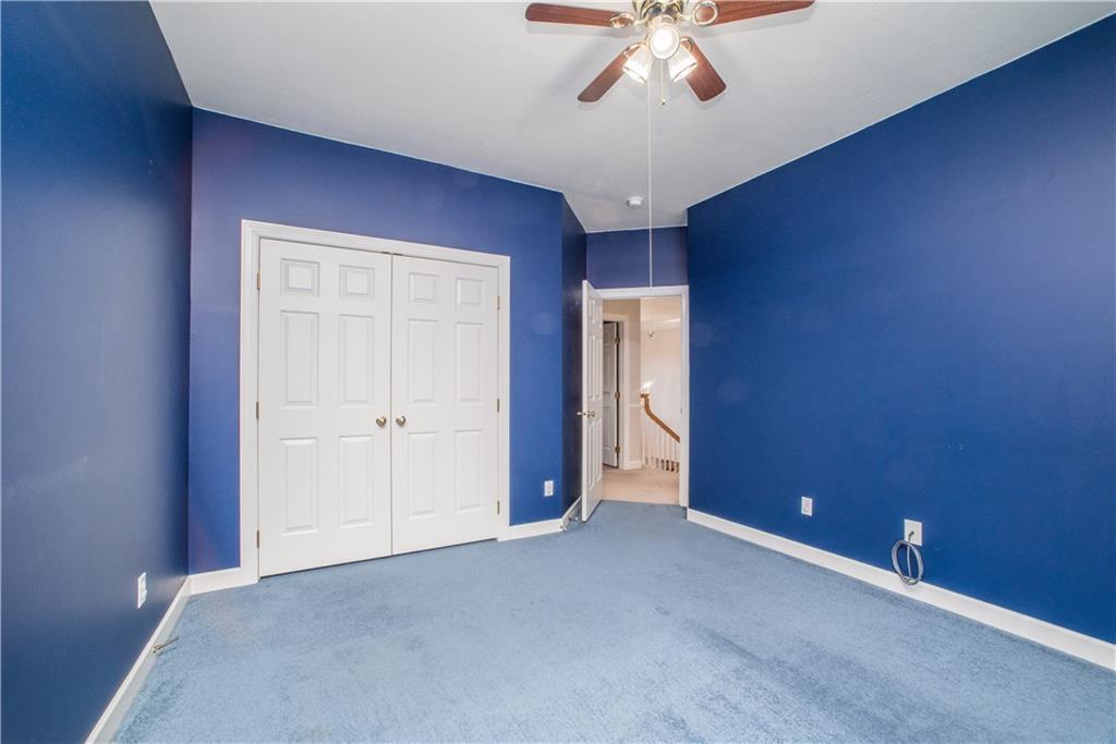 8404 David Drive Bridgeville, PA 15017 - Photo 14 of 25 a view of an empty room with a chandelier