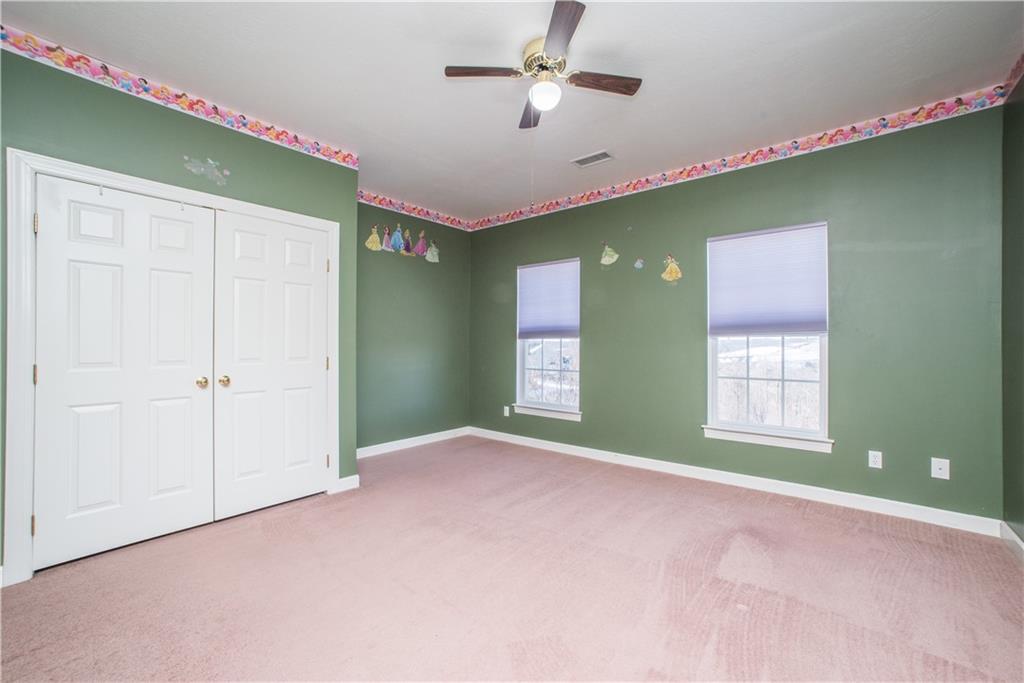 8404 David Drive Bridgeville, PA 15017 - Photo 18 of 25 a view of an empty room with a window and fireplace