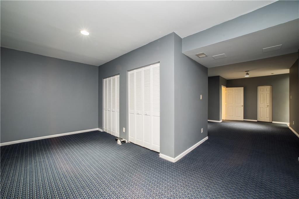 8404 David Drive Bridgeville, PA 15017 - Photo 20 of 25 an empty room with wooden floor and windows