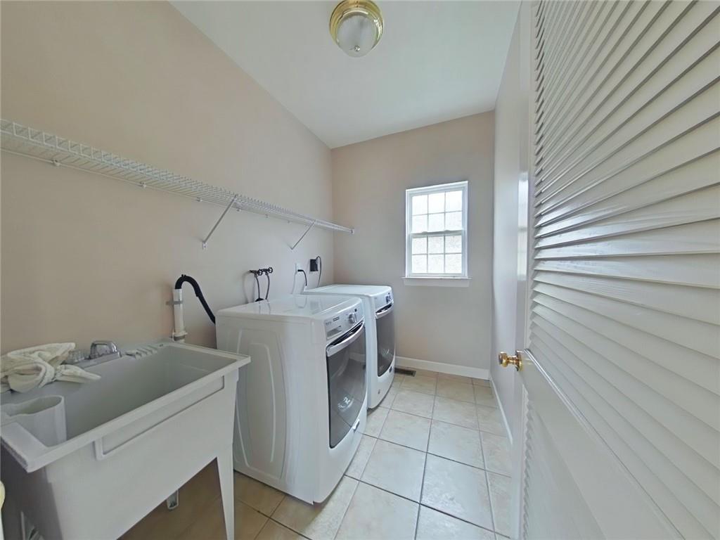 8404 David Drive Bridgeville, PA 15017 - Photo 23 of 25 a utility room with a sink dryer and washer