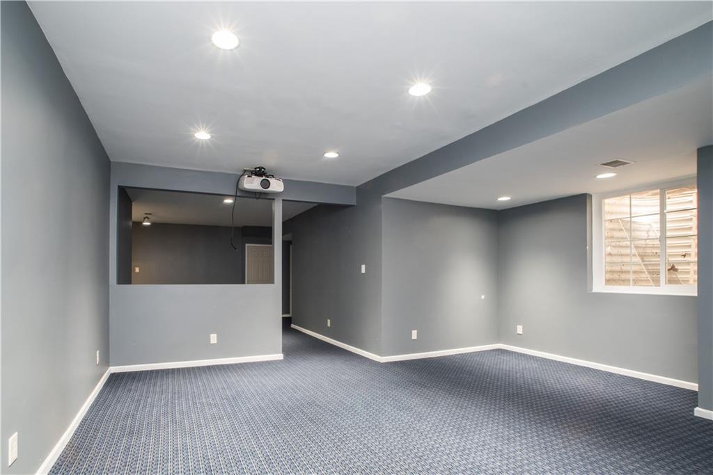 8404 David Drive Bridgeville, PA 15017 - Photo 25 of 25 an empty room with wooden floor and a hallway