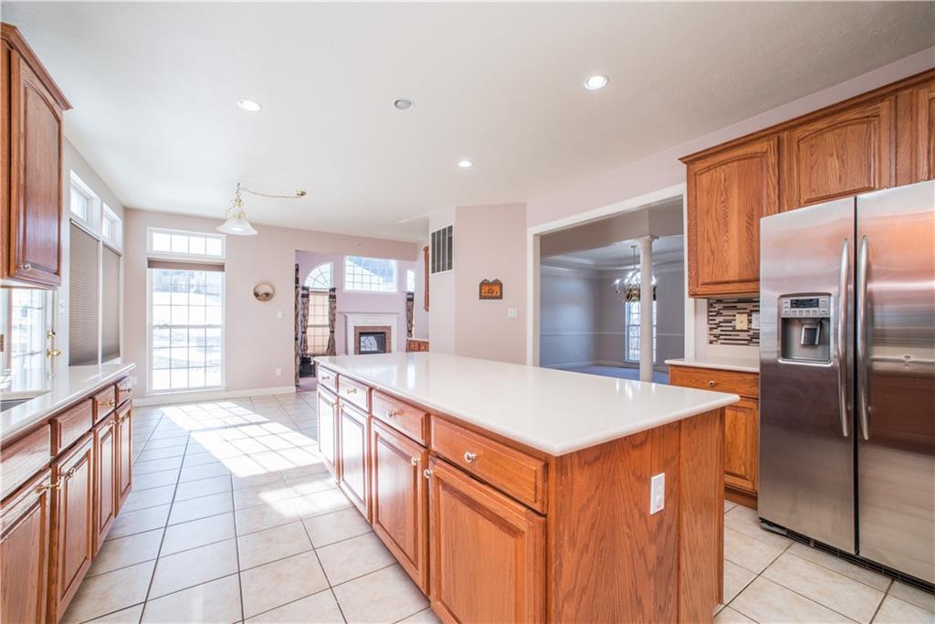 8404 David Drive Bridgeville, PA 15017 - Photo 7 of 25 a kitchen with stainless steel appliances a sink and a refrigerator