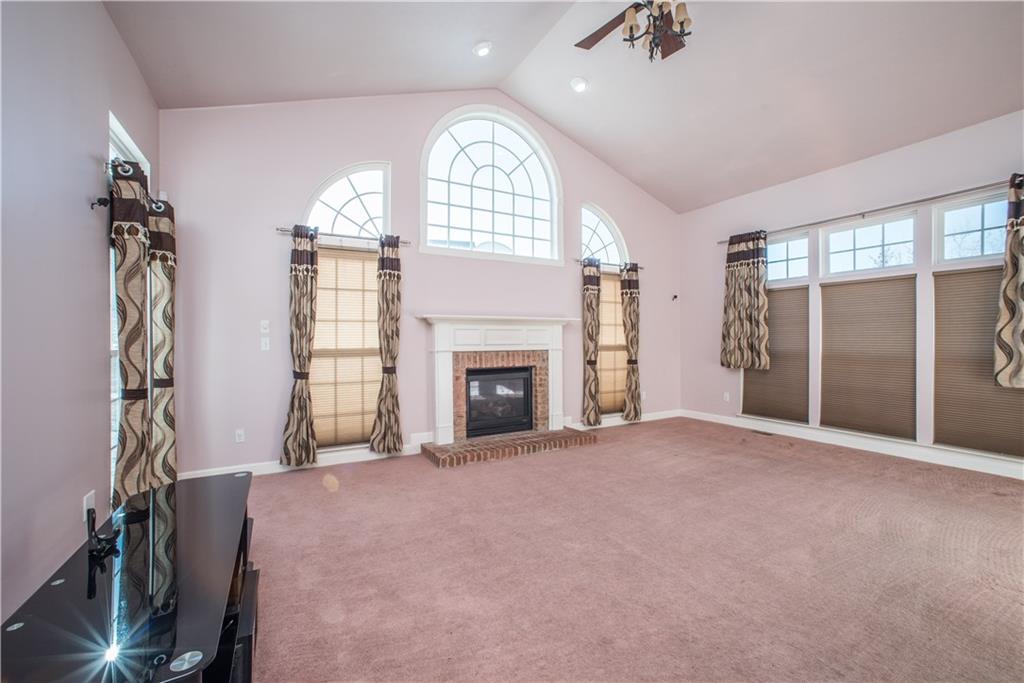 8404 David Drive Bridgeville, PA 15017 - Photo 8 of 25 a view of an empty room with a fireplace and a window