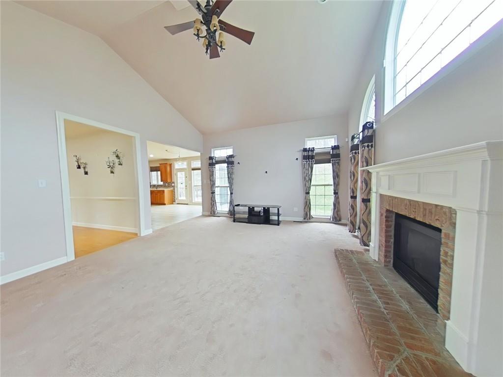 8404 David Drive Bridgeville, PA 15017 - Photo 9 of 25 a big room with chandelier and fireplace