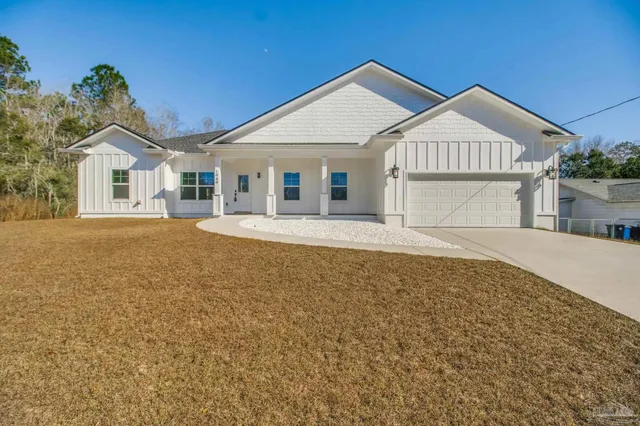 front view of a house with a yard