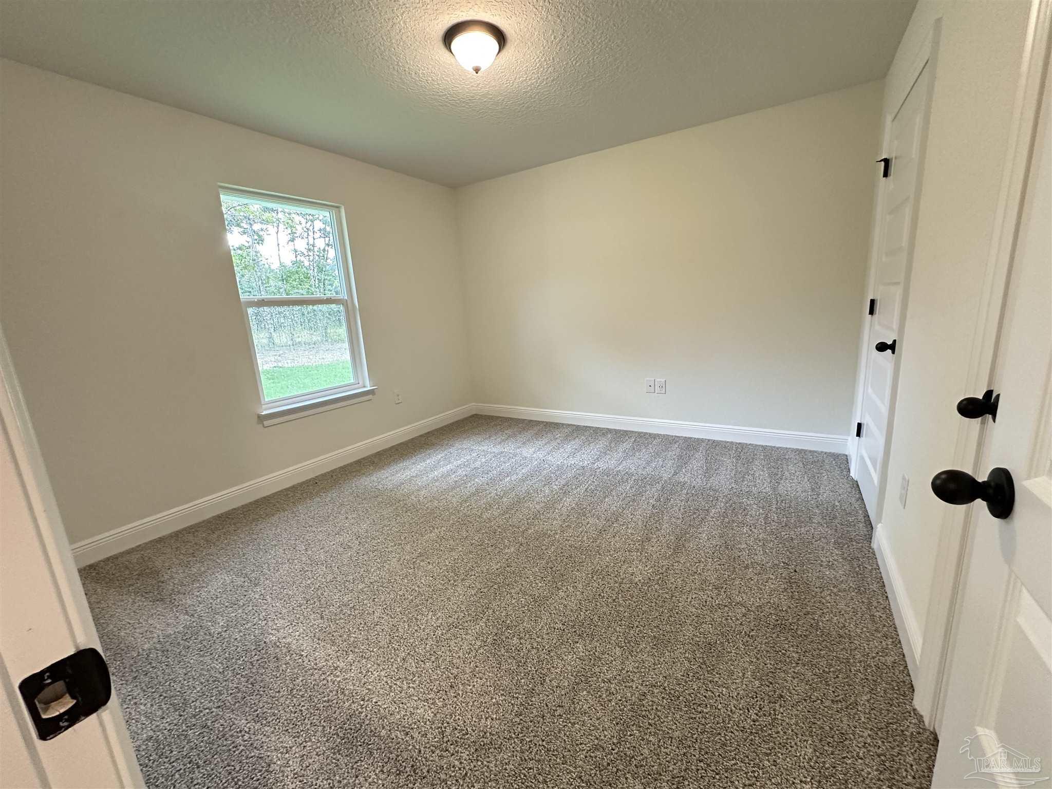 5214 Barnett Road Milton, FL 32583 - Photo 14 of 22 an empty room with windows