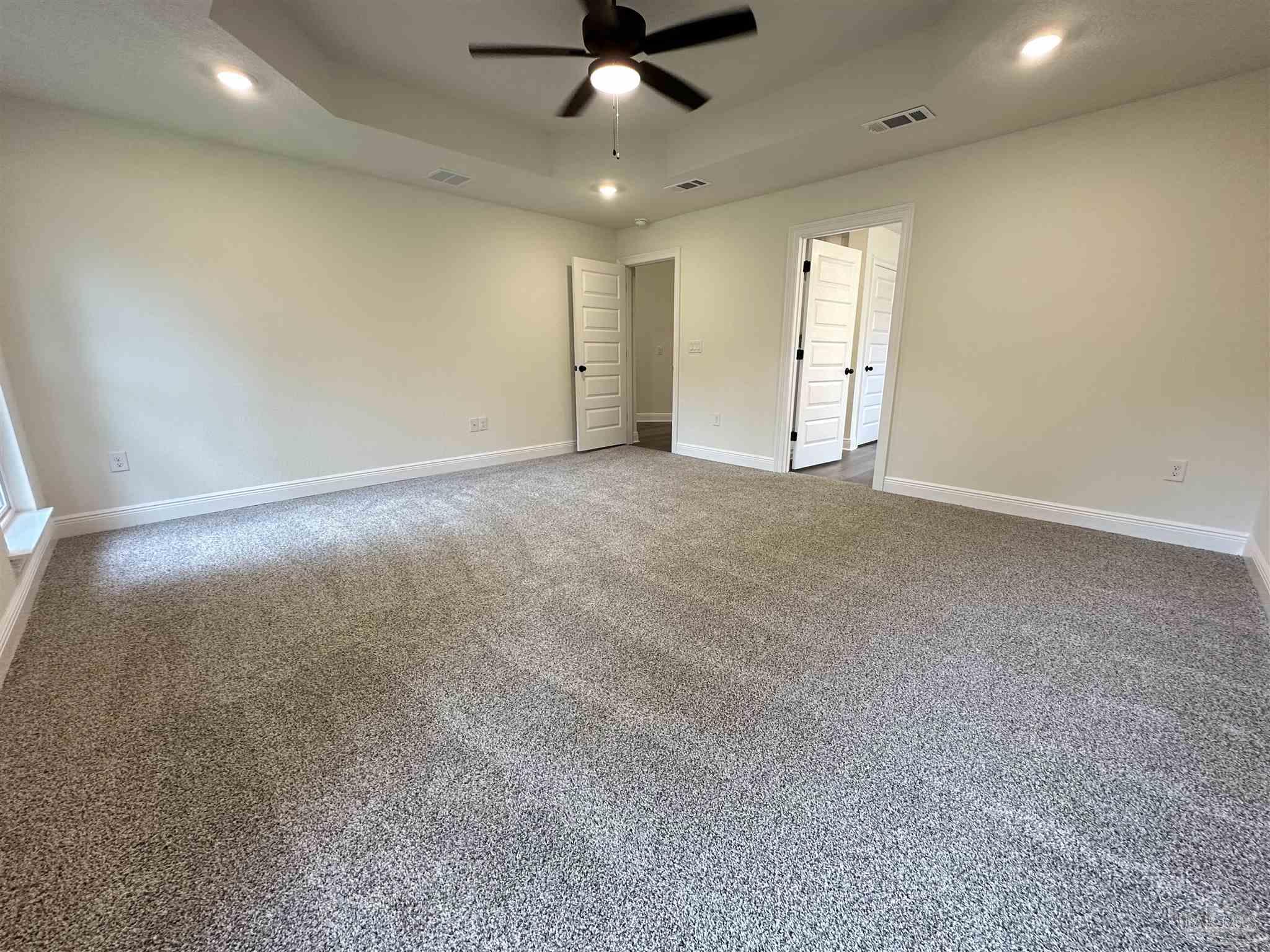 5214 Barnett Road Milton, FL 32583 - Photo 20 of 22 an empty room with a ceiling fan and window