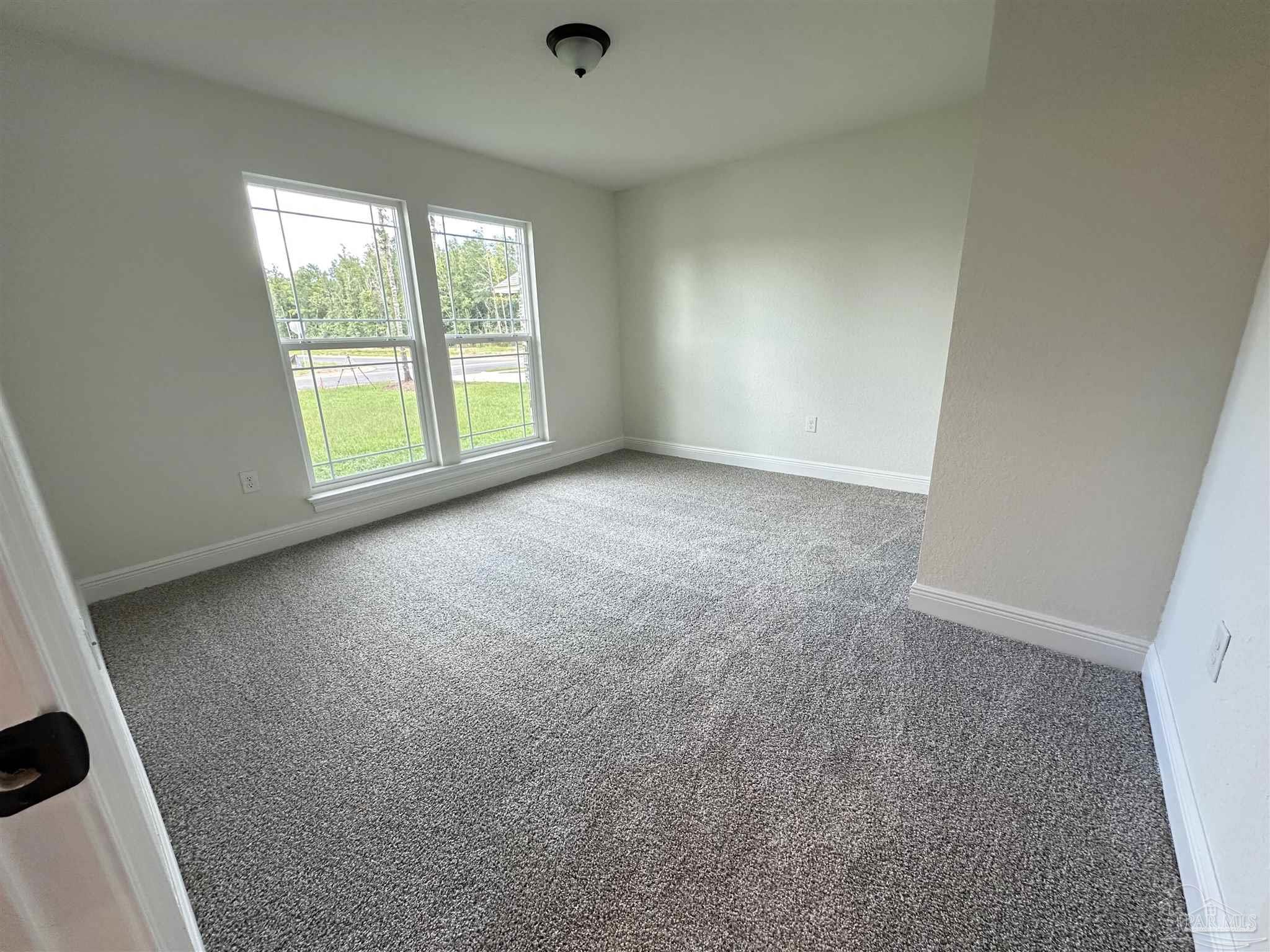 5214 Barnett Road Milton, FL 32583 - Photo 21 of 22 an empty room with windows