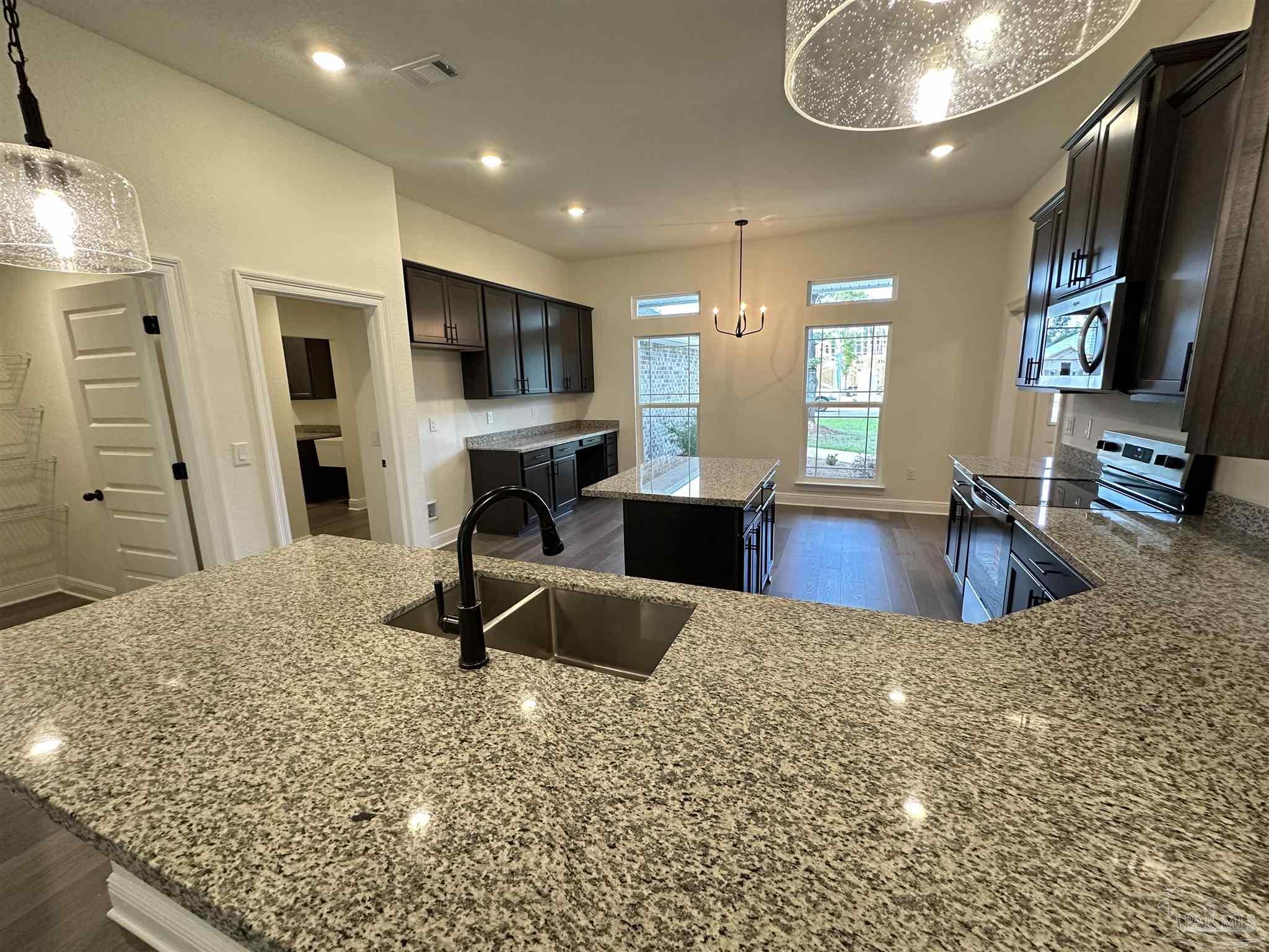 5214 Barnett Road Milton, FL 32583 - Photo 9 of 22 a living room with furniture a flat screen tv and a large window