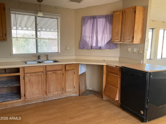 a kitchen with a sink and cabinets